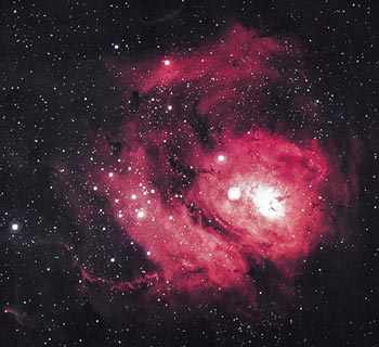 The Lagoon nebula is a cloud of gas and dust, about 60 light years in diameter. It is excited by the ultraviolet radiation of the hot stars that have recently formed within its bulk.